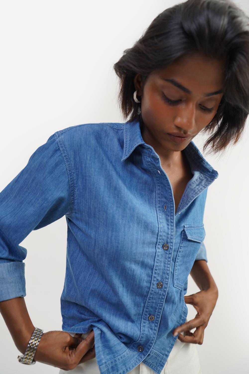 Stylish women's denim shirt, perfect jeans top for girls, featuring a cropped design and sleeveless style.