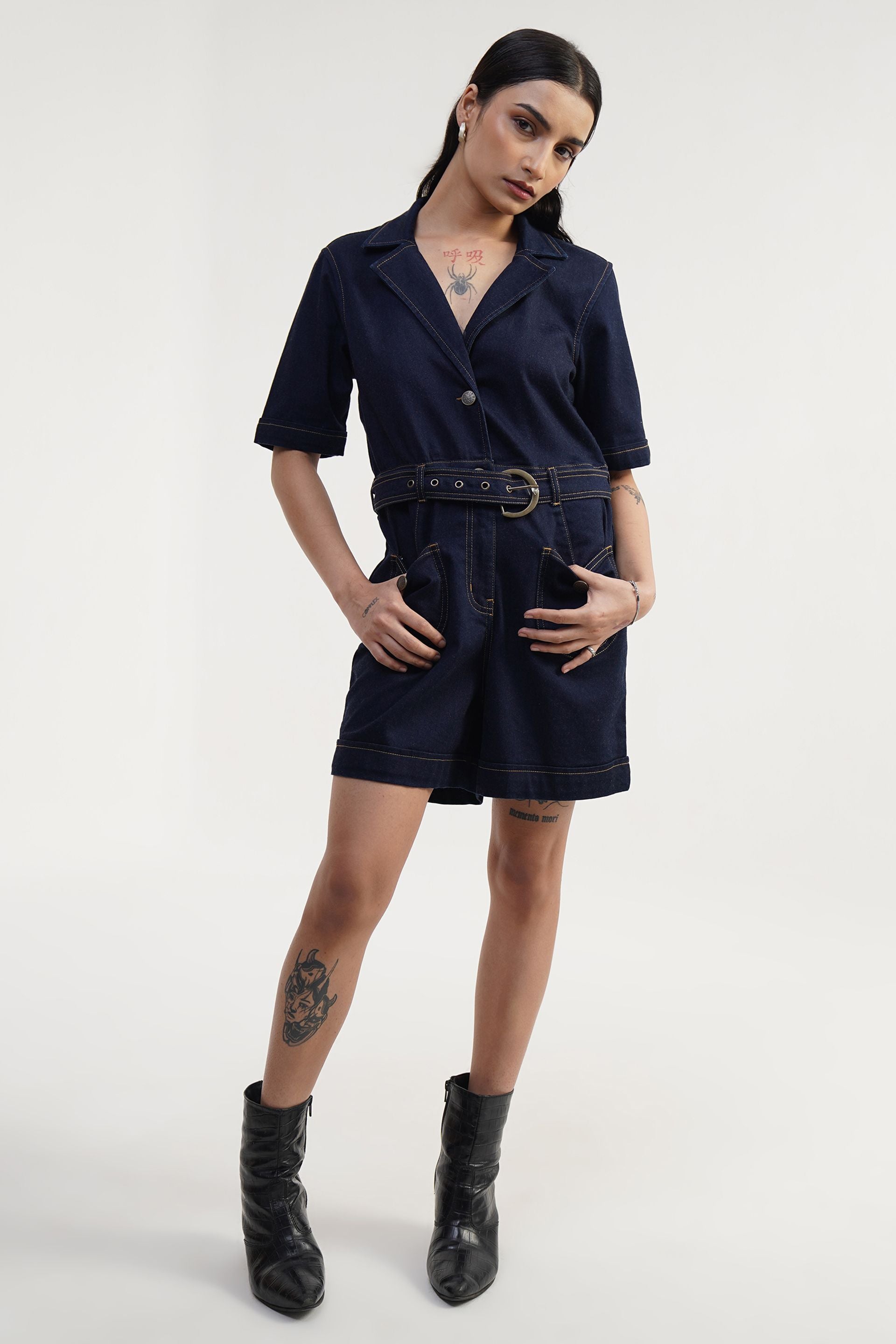 Stylish womens denim dungarees showcasing wide-leg and belted design, perfect casual playsuit for any occasion.