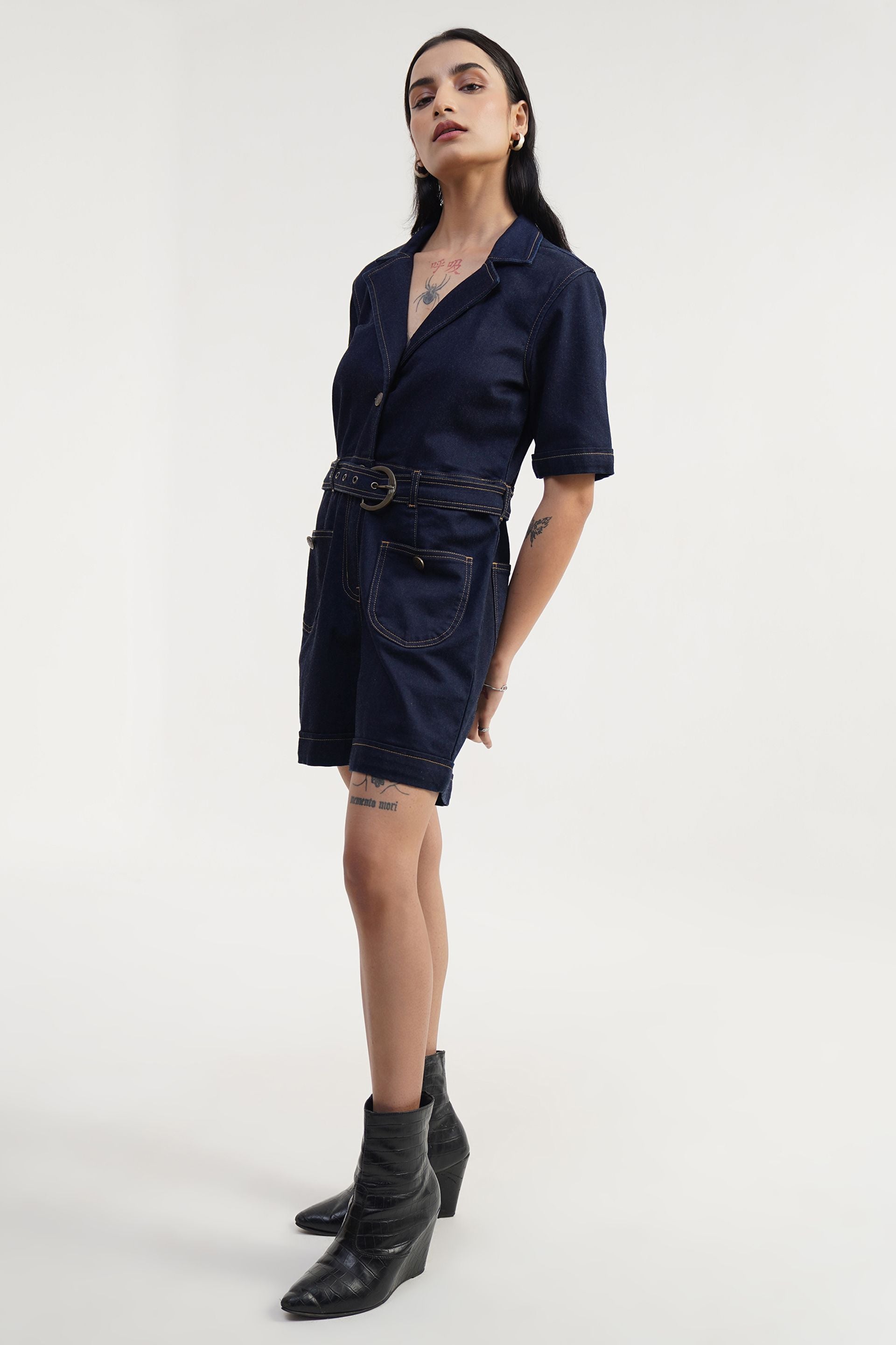 Women’s navy denim jumpsuit in relaxed fit, minimal Prism Play style, rinse wash cotton with stretch