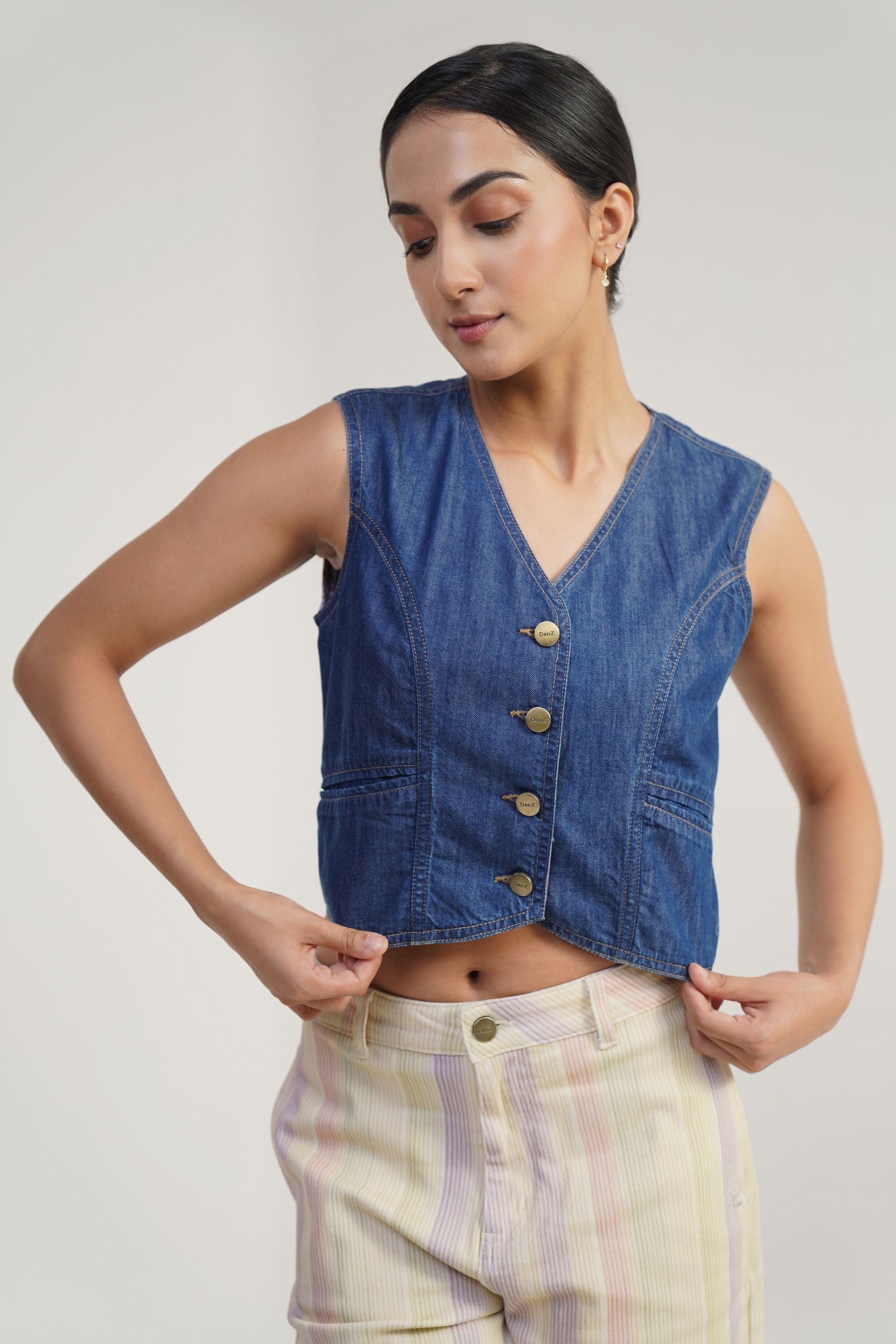 Mid blue relaxed fit cotton and lyocell vest, retro rinse wash, front buttoned with two welt pockets